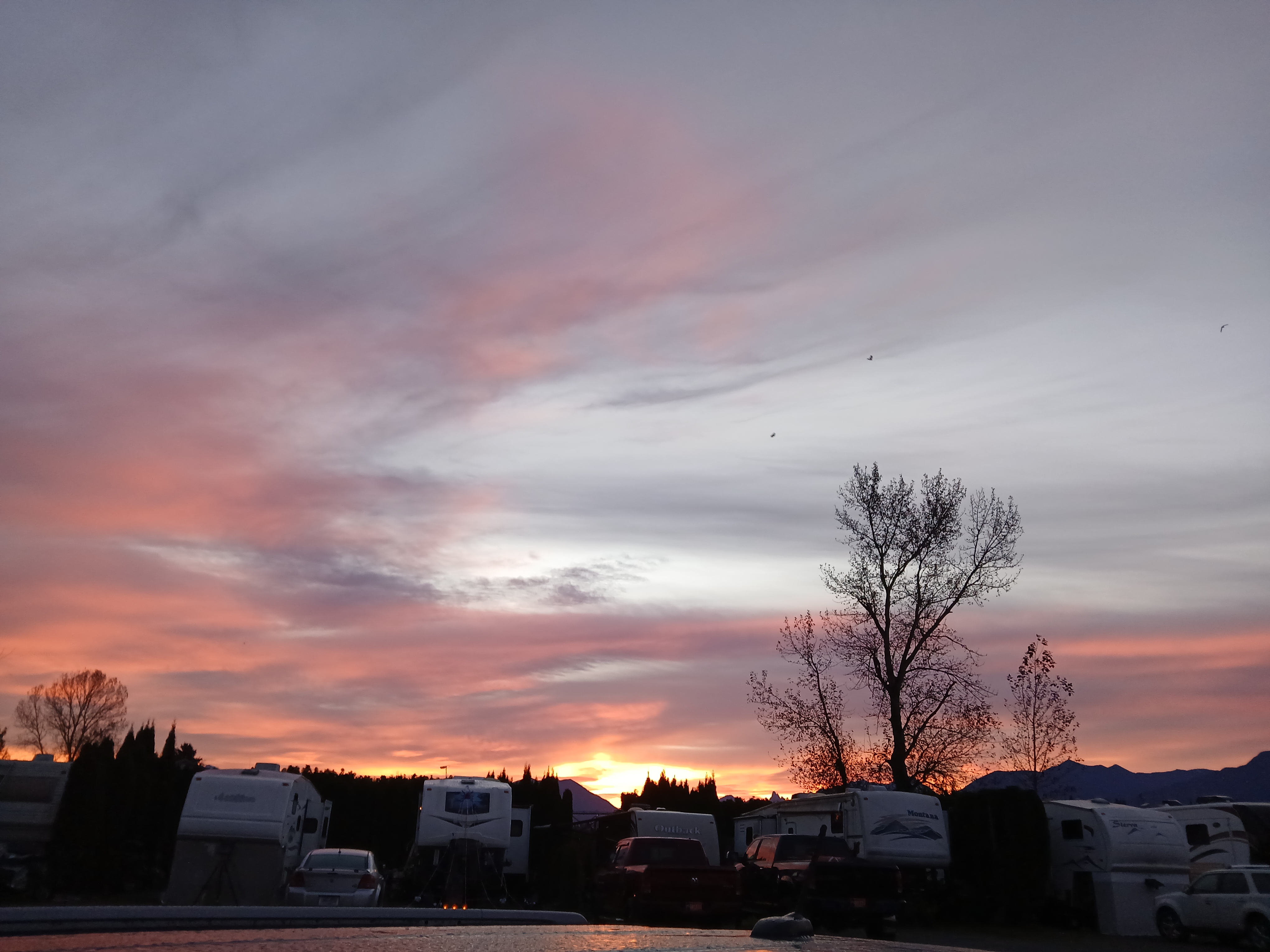 Royalwood RV Park at sunset with mountain views
